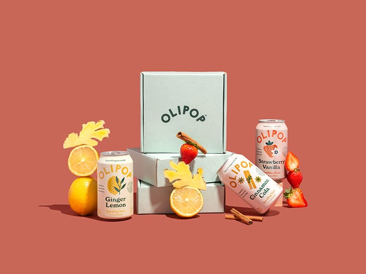 Olipop products and packaging on a dark orange background